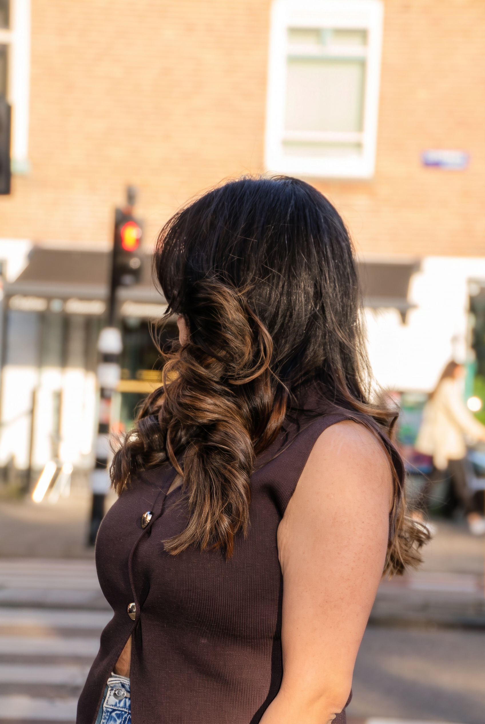 Client with sleek waves after a wash and blow dry at Icon Hair Salon Amsterdam Zuid