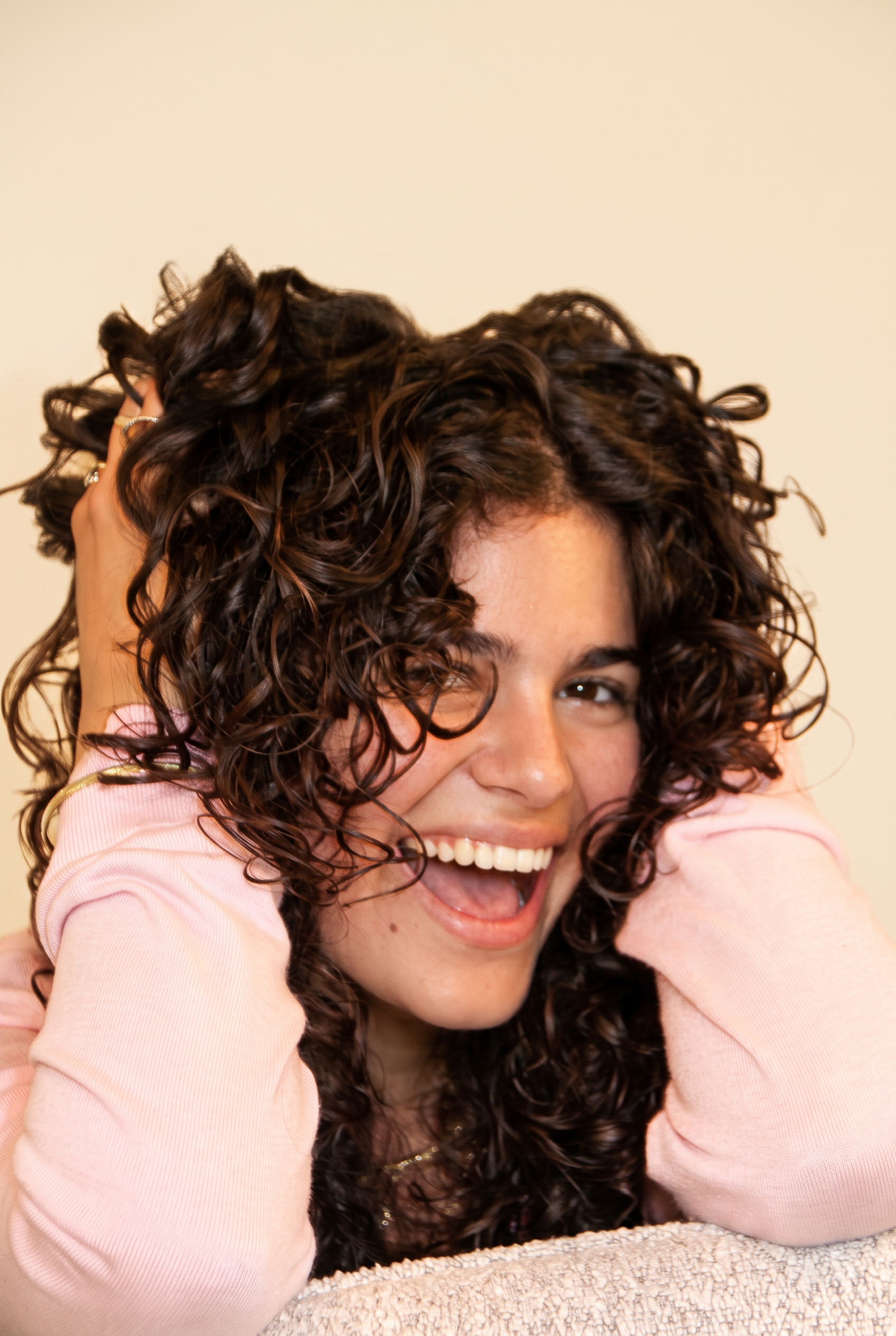 Client with defined natural curls after a curly cut at Icon Hair Salon Amsterdam Zuid