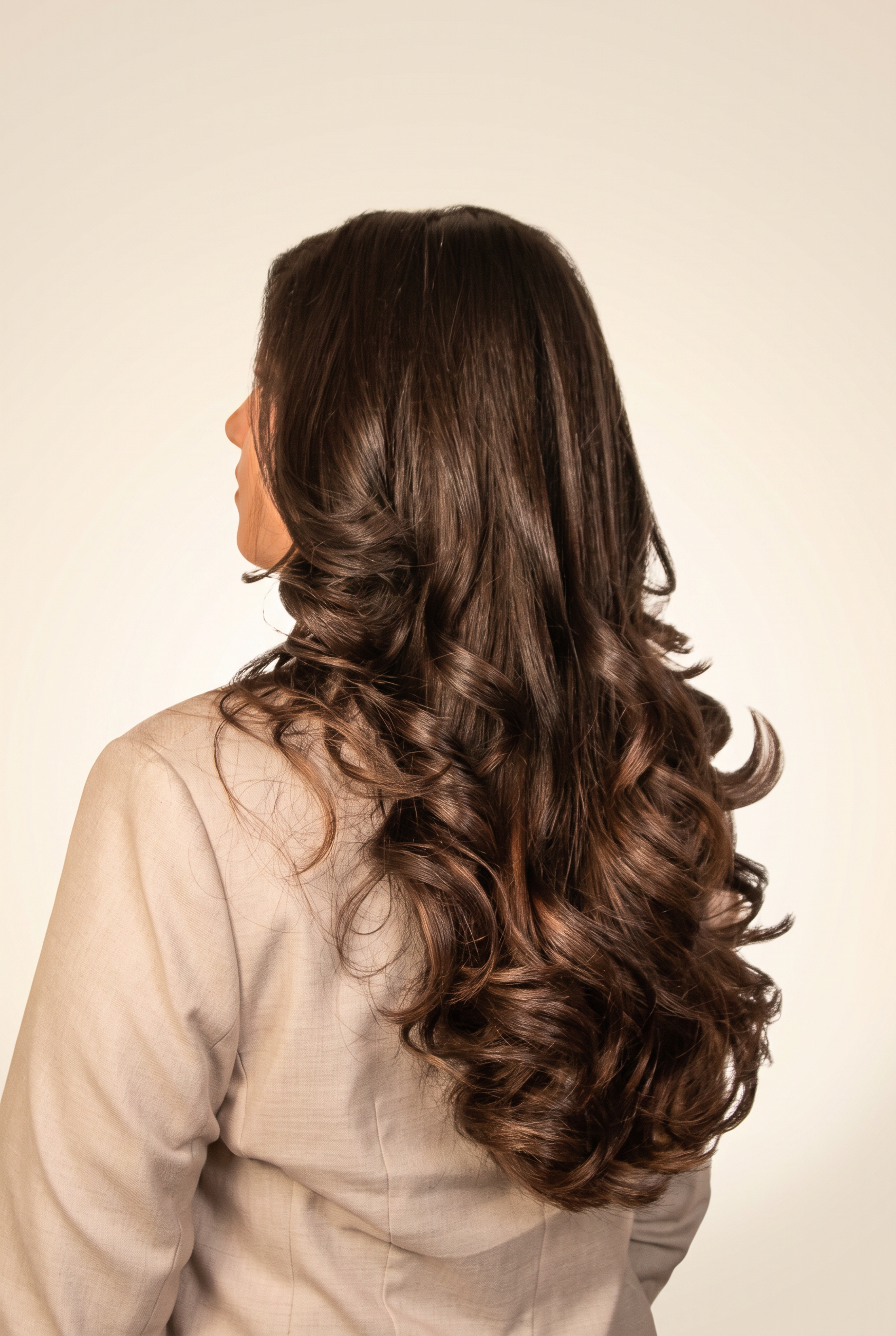 Back view of long hair with round brush curls finished at Icon Hair Salon Amsterdam Zuid