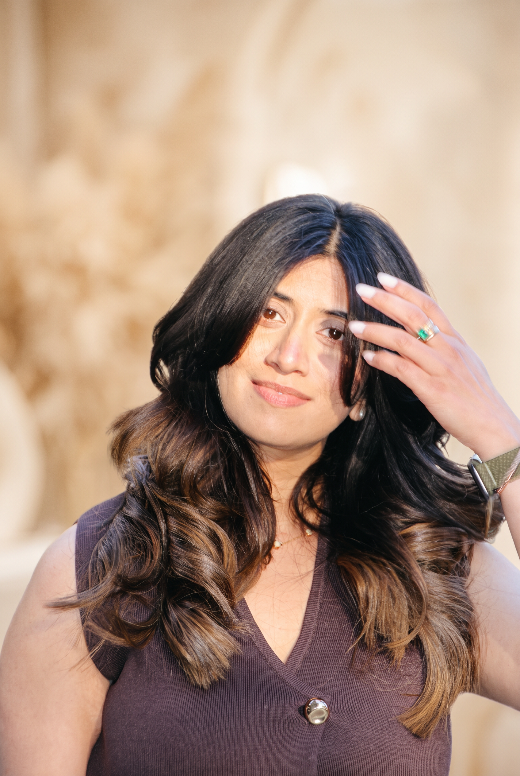 Client with a soft bouncy blow dry outside Icon Hair Salon on Marathonweg